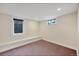 Finished basement featuring a carpeted floor and a window with a window well to allow natural light at 770 Locust, Denver, CO 80220