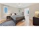 Cozy bedroom with natural light, hardwood flooring, and neutral decor at 770 Locust, Denver, CO 80220