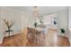 Elegant dining area open to a modern kitchen with hardwood floors at 770 Locust, Denver, CO 80220