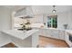 Contemporary kitchen with quartz countertops, stainless appliances, and sleek white cabinets at 770 Locust, Denver, CO 80220