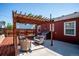 Relaxing backyard patio with stylish pergola and seating, perfect for outdoor gatherings at 1955 Ingalls St, Lakewood, CO 80214
