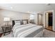Comfortable bedroom featuring a striped bedspread, a neutral rug, and recessed lighting at 1955 Ingalls St, Lakewood, CO 80214