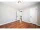Inviting bedroom with pristine hardwood floors and access to closet and hallway at 1955 Ingalls St, Lakewood, CO 80214
