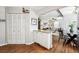 Open dining area with hardwood floors, leading into the living room at 1955 Ingalls St, Lakewood, CO 80214