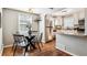 Bright eat-in kitchen with stainless steel appliances, granite countertops, and modern cabinetry at 1955 Ingalls St, Lakewood, CO 80214