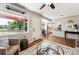 Bright living room featuring hardwood floors, a large window, and a seamless transition to the kitchen at 1955 Ingalls St, Lakewood, CO 80214