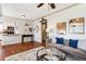 Inviting living room with hardwood floors, stylish decor, and an open layout to the kitchen at 1955 Ingalls St, Lakewood, CO 80214