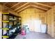 Interior shed with shelving and exposed rafter showing ample storage space at 1955 Ingalls St, Lakewood, CO 80214