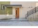 Exterior shot of the front entrance, displaying the door, house number, and front stairway at 3150 Vallejo St, Denver, CO 80211