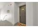 Apartment entrance featuring unit number, a welcome mat, and access to upper levels at 14321 E Tennessee Ave # 1-301, Aurora, CO 80012