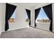 This bedroom has large windows that bring in natural light and dark curtains at 14321 E Tennessee Ave # 1-301, Aurora, CO 80012