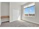 Bright bedroom with a large window offering natural light and a built-in desk at 14321 E Tennessee Ave # 1-301, Aurora, CO 80012