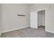 A minimalist bedroom design with neutral colors and a modern shelf at 14321 E Tennessee Ave # 1-301, Aurora, CO 80012