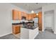 Modern kitchen featuring stainless steel appliances, granite countertops, and wood cabinetry at 14321 E Tennessee Ave # 1-301, Aurora, CO 80012
