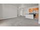 Spacious living area adjacent to a well-equipped kitchen, perfect for entertaining and modern living at 14321 E Tennessee Ave # 1-301, Aurora, CO 80012