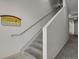 Hall stairwell leading up to the second and third level units of the building at 14321 E Tennessee Ave # 1-301, Aurora, CO 80012