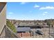Elevated community view showcasing a parking lot, landscaping, and surrounding buildings at 14321 E Tennessee Ave # 1-301, Aurora, CO 80012