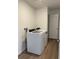 Convenient laundry room with modern, white washer and dryer at 21934 E 39Th Ave, Aurora, CO 80019