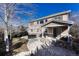 Backyard features a patio, grill, hot tub, stone features, and manicured lawn at 10761 Hillsboro Cir, Parker, CO 80134