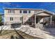 Back of house featuring a hot tub and covered patio at 10761 Hillsboro Cir, Parker, CO 80134