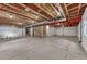 Unfinished basement with concrete floor and exposed ceiling, offering potential for customization at 10761 Hillsboro Cir, Parker, CO 80134
