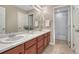 Bathroom featuring double vanity and shower at 10761 Hillsboro Cir, Parker, CO 80134