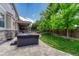 Hot tub on a patio featuring a covered patio and manicured lawn at 10761 Hillsboro Cir, Parker, CO 80134