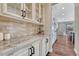 Kitchen features granite counters, subway tile backsplash, and stainless appliances at 10761 Hillsboro Cir, Parker, CO 80134