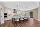 Bright kitchen features an island with seating, pendant lights, and stainless steel appliances at 10761 Hillsboro Cir, Parker, CO 80134