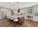 Beautiful kitchen featuring a large island with seating, stainless steel appliances, and custom finishes at 10761 Hillsboro Cir, Parker, CO 80134