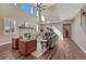 Bright living room with stone fireplace and hardwood floors at 10761 Hillsboro Cir, Parker, CO 80134