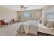 Comfortable main bedroom with ceiling fan, neutral carpet, and soft lighting at 10761 Hillsboro Cir, Parker, CO 80134