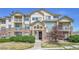 Attractive townhome with brick accents, balconies, and well-maintained landscaping at 5714 N Gibralter Way # 5-204, Aurora, CO 80019