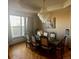 This is a formal dining room complete with chandelier and seating for 8 at 13291 N Harback Rd, Bennett, CO 80102