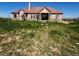 Charming single-story home featuring a classic design and well-manicured front lawn at 13291 N Harback Rd, Bennett, CO 80102
