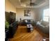 Inviting living room featuring hardwood floors and abundant natural light at 13291 N Harback Rd, Bennett, CO 80102