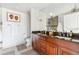 Bathroom featuring a double sink vanity with granite countertops, ample cabinet space, and modern fixtures at 1411 Wynkoop St # 806, Denver, CO 80202