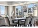 Modern dining room features a long table and city views at 1411 Wynkoop St # 806, Denver, CO 80202