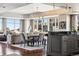 Open concept living, dining, and kitchen area with hardwood floors and abundant natural light at 1411 Wynkoop St # 806, Denver, CO 80202