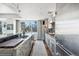 Well-equipped kitchen with bar seating, stone countertops, and stainless appliances at 1411 Wynkoop St # 806, Denver, CO 80202