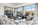 Bright living room with a modern fireplace, comfortable seating, and expansive city views through large windows at 1411 Wynkoop St # 806, Denver, CO 80202