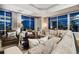 Elegant living room featuring plush seating and expansive windows with city views at 1411 Wynkoop St # 806, Denver, CO 80202