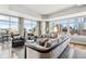 Bright living room showcasing comfortable seating and stunning city views from expansive windows at 1411 Wynkoop St # 806, Denver, CO 80202