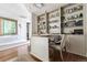 Well-lit home office featuring custom built-in shelving and hardwood flooring at 1411 Wynkoop St # 806, Denver, CO 80202