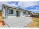 Relaxing deck with easy access to yard, ideal for enjoying outdoor living and entertaining at 7610 S Garland St, Littleton, CO 80128