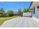 Wide-angle back deck view and lovely green grass space, perfect for outdoor living at 7610 S Garland St, Littleton, CO 80128