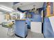 Finished basement featuring a bar area with seating, fridge, and fun decor at 7610 S Garland St, Littleton, CO 80128
