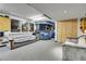 Finished basement featuring a bar area, comfortable seating, and recreational space at 7610 S Garland St, Littleton, CO 80128