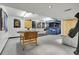 Finished basement area featuring a rec space, seating, and a bar for entertaining at 7610 S Garland St, Littleton, CO 80128