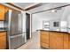 Updated kitchen features stainless appliances and granite countertops and an open floor plan at 7610 S Garland St, Littleton, CO 80128